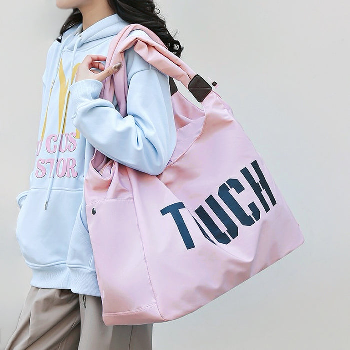 Front view of Pink nylon Touch Weekend Bag with twin handles, zip-top, and outer slip pockets, great for everyday.