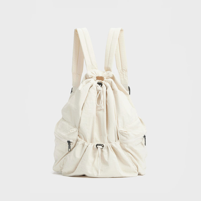 Front view of white nylon drawstring bag; water-resistant finish perfect for gym gear and outdoor activities.