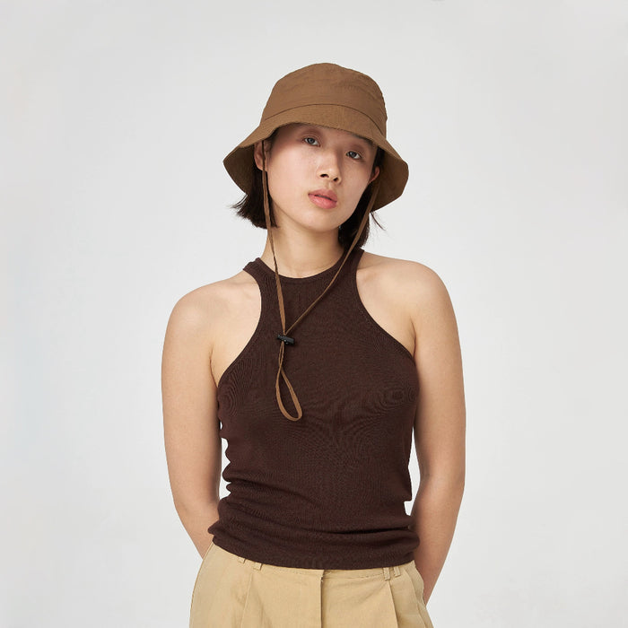 Woman wearing brown nylon ultralight quick-dry bucket hat with an adjustable windproof cord for hiking.