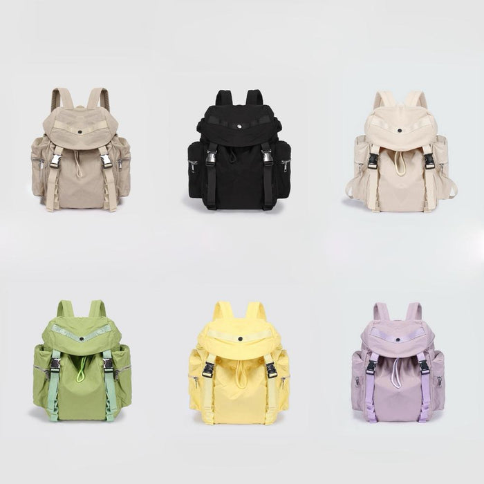Front view of Six polyester Ultralight Urban Daily Backpacks in beige, black, cream, green, yellow, and lavender.