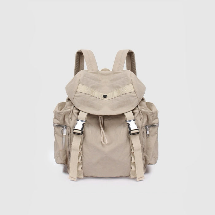 Angled view of khaki polyester ultralight urban daily backpack with flap top, dual buckles, drawstring, and side zip.