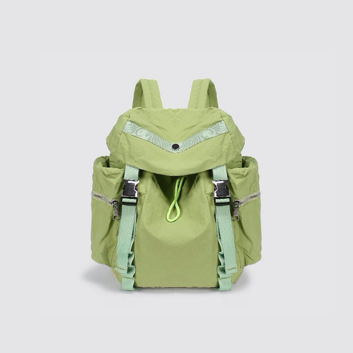 Close-up of Ultralight Urban Daily Backpack in green, vibrant outdoor gear.