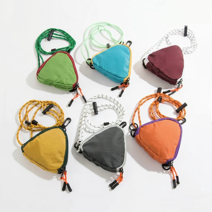 Flat lay grid displaying all 6 available colors of the mini triangle nylon pouch including orange, black, green, blue, burgundy and yellow.