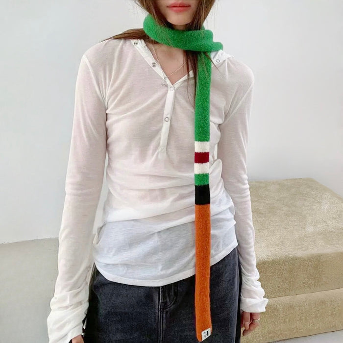 Model wearing colorblocked skinny polyester scarf in green, white, red, black, and orange, ideal for daily.