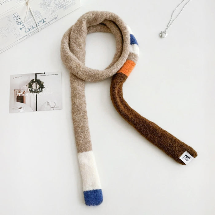 Flat lay of Vibrant Colorblocked Skinny Scarf, great for office layering and commuting.