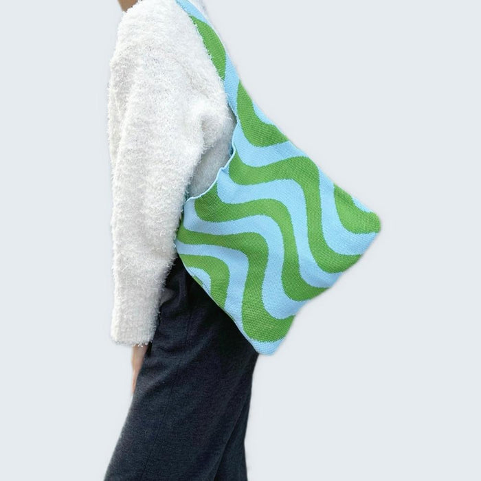 Model carrying a blue green Wave Pattern Knitted Bag on shoulder, great for daily carry and travel.