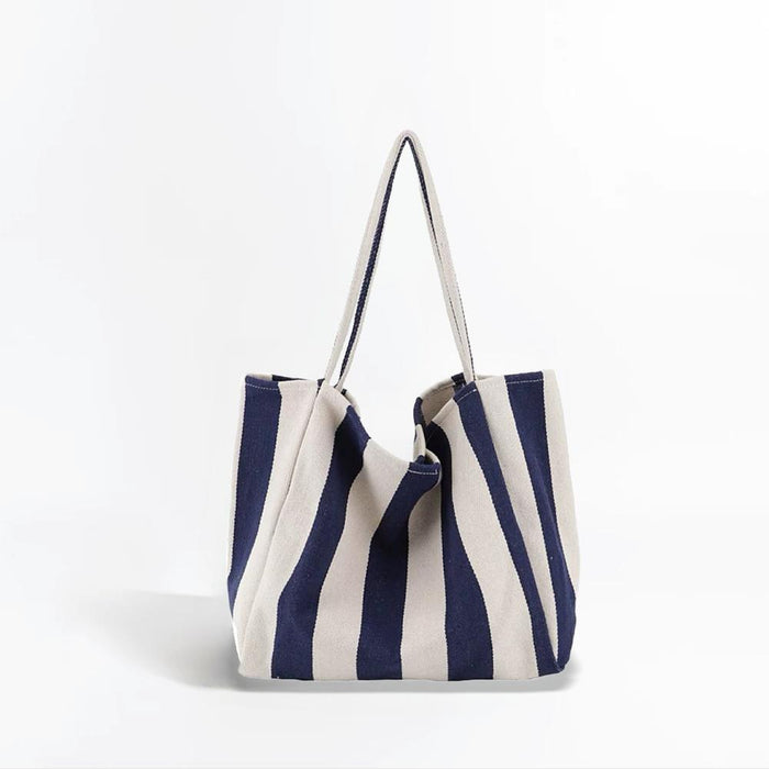 Folded view of Wide Stripe Canvas Tote Bag in navy blue, easy for commuting and weekends.