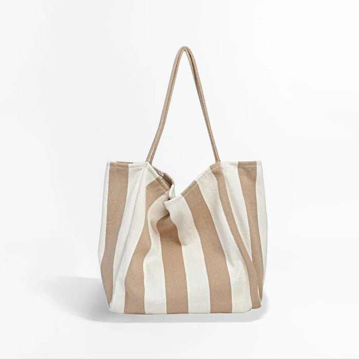 Folded view of Wide Stripe Canvas Tote in khaki,  great for everyday carry and travel.