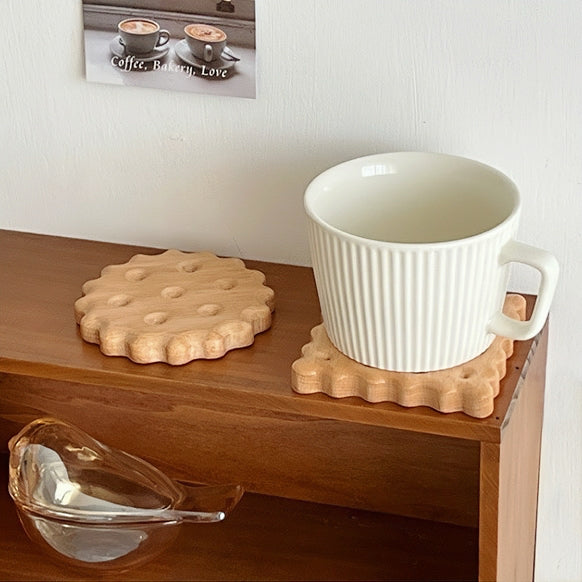 Close-up of  2 piecesof Wooden Biscuit Coaster in round and square shapes..