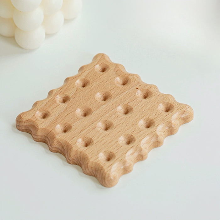 Detail view of  Wooden Biscuit Coaster in square shape.