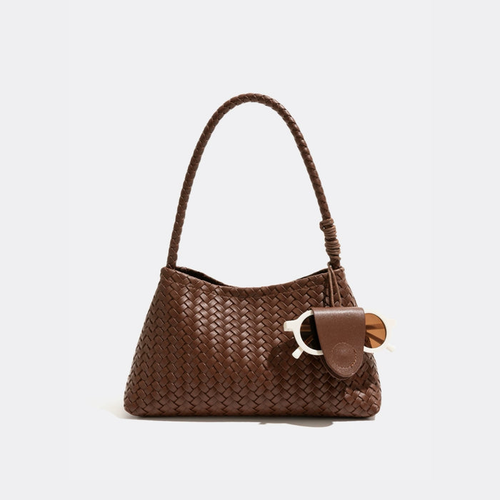 Front view of Brown woven PU leather shoulder bag with a detachable glasses holder and sunglasses, great for everyday.