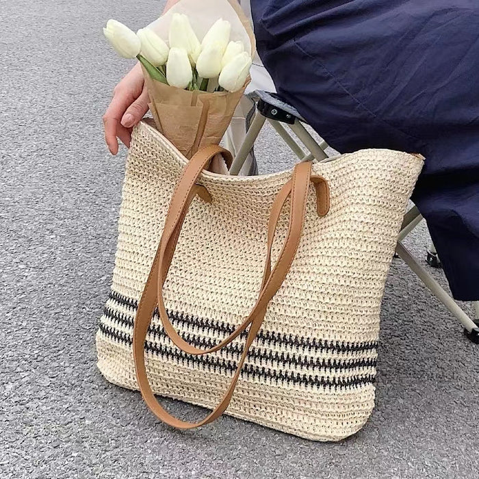Flat lay of Woven Straw Tote Bag in Beige, great for everyday carry and travel.
